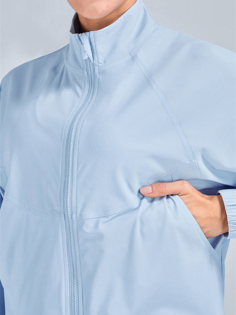 Light blue women's stand collar zipper short jacket with breathable material, ideal for casual sports and everyday wear. SF1448.
